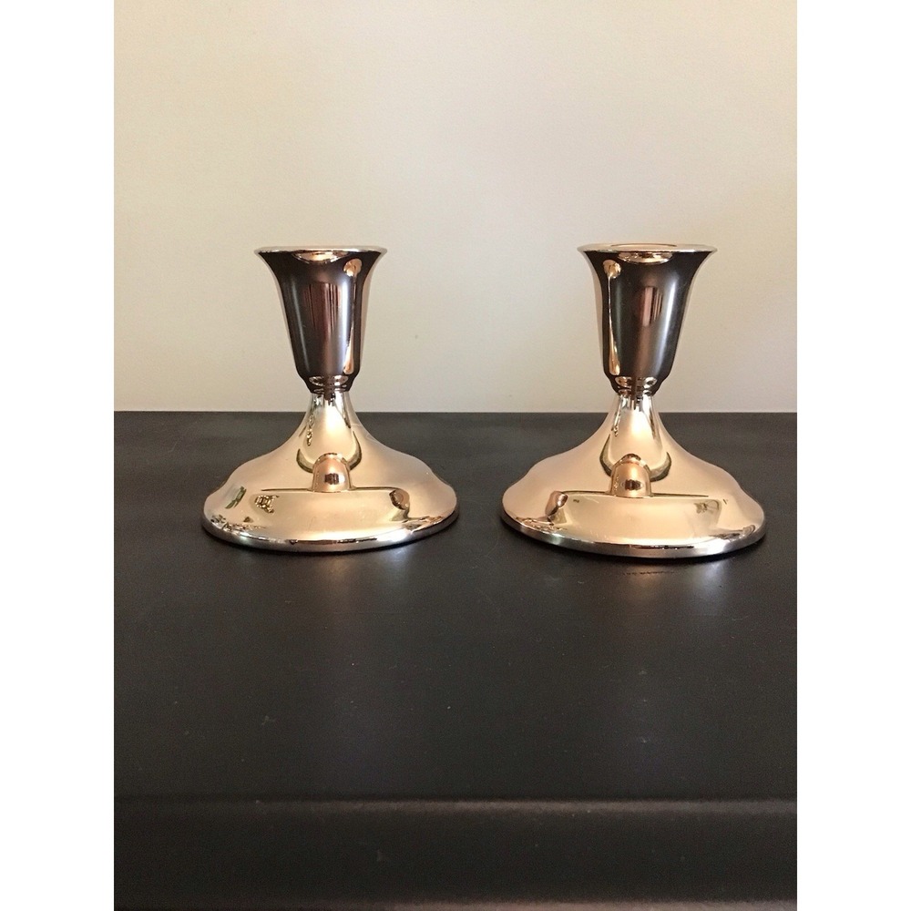 Beautiful bronze candle holders with felt bottoms